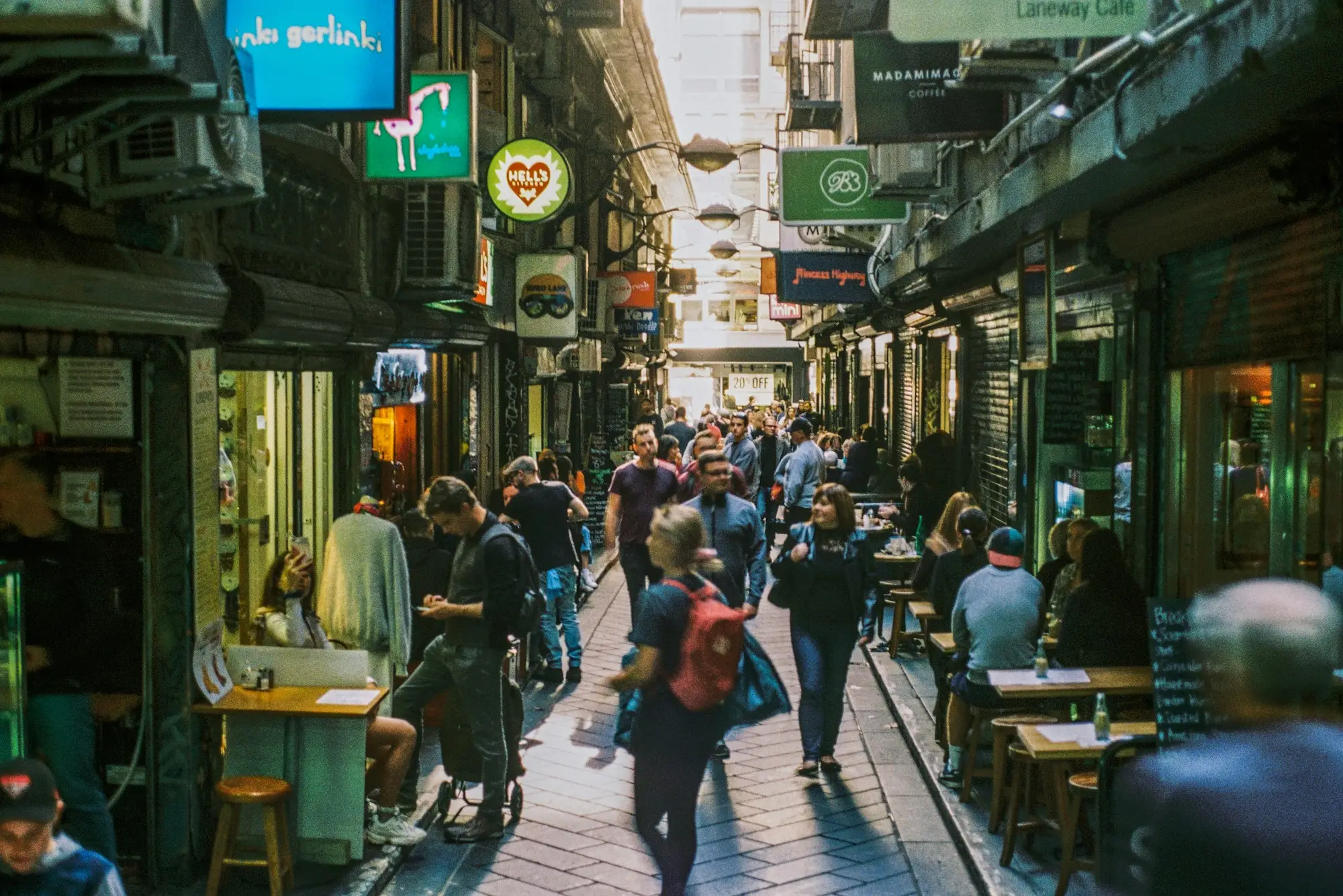 Busy laneway lined with cafes on Degraves Street, Melbourne