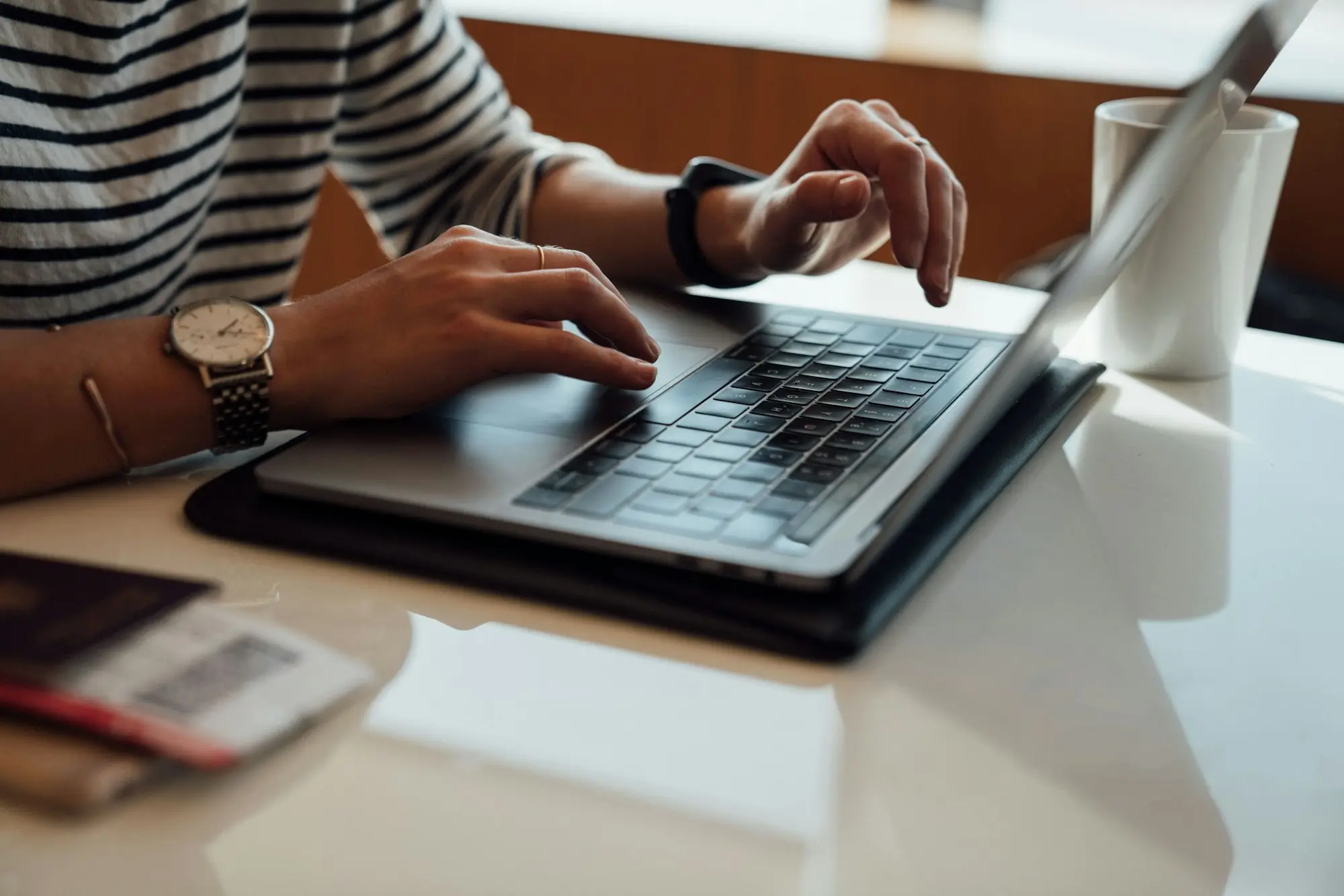 Business owner working through accounts on a laptop